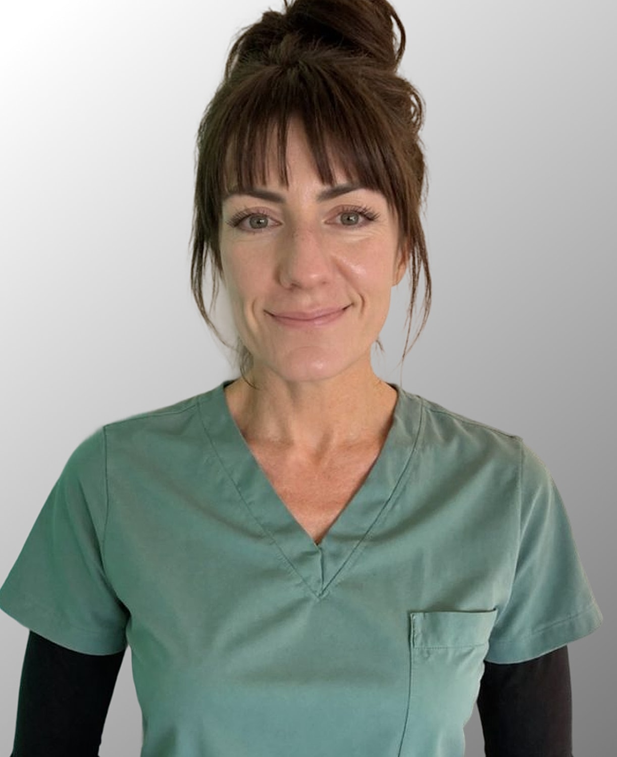 Female healthcare professional in scrubs.