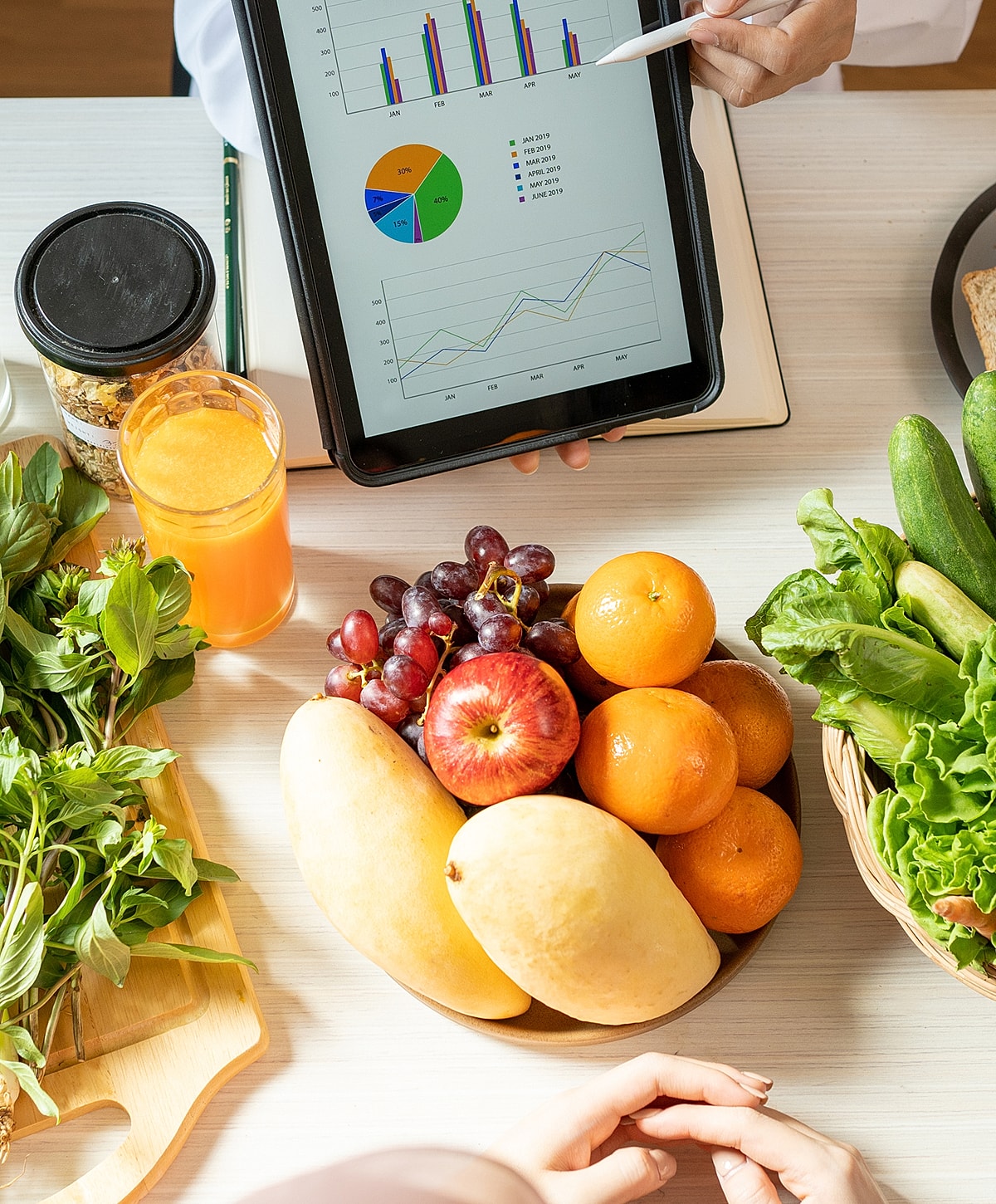 Fresh fruits and vegetables with data analysis tools.