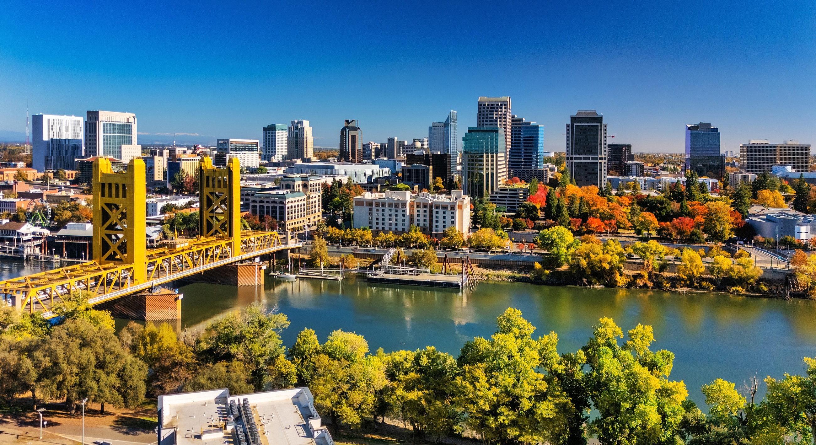 Sacramento skyline with colorful autumn trees.